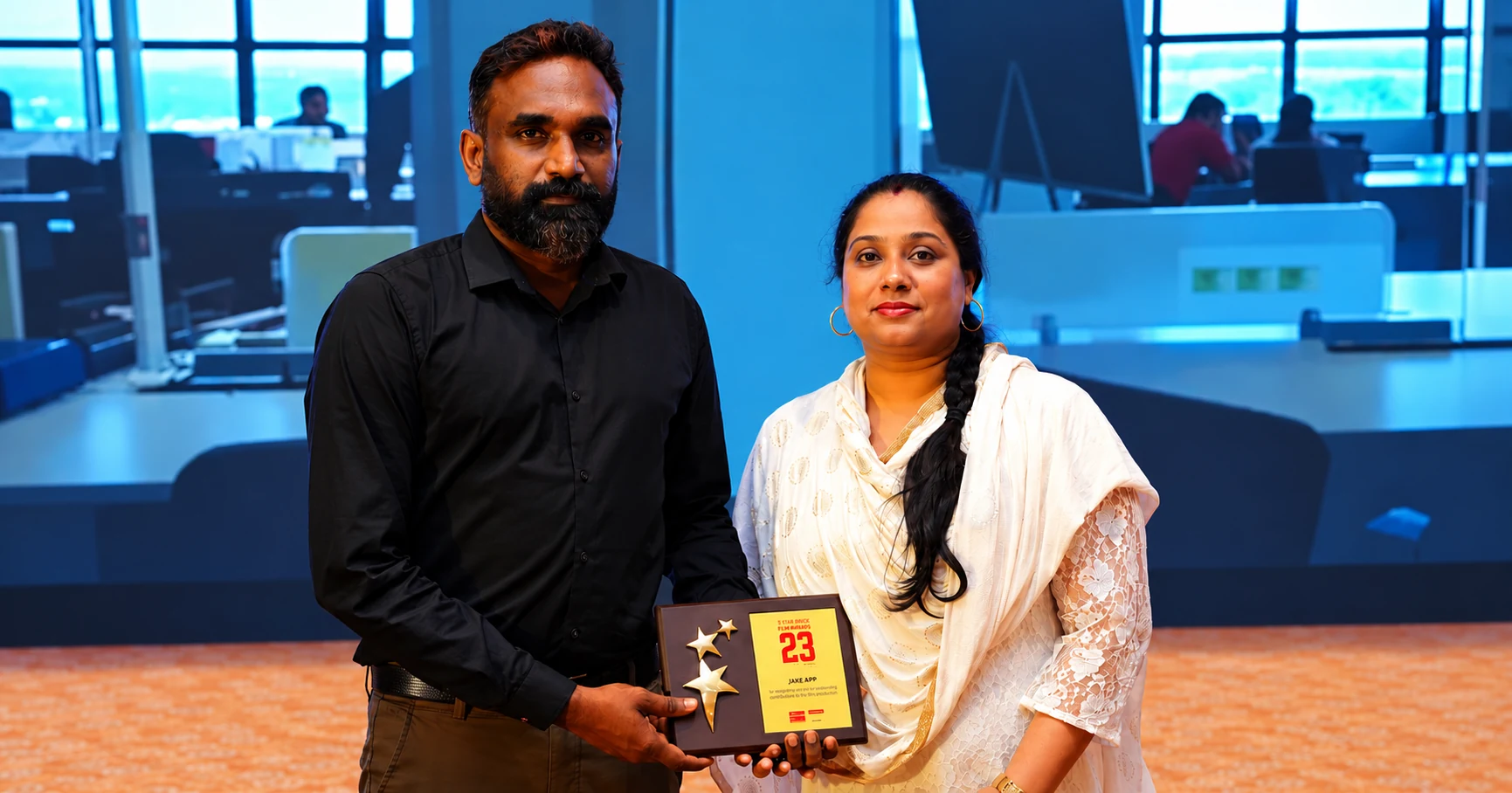 Chandrasekhar G holding the Headstart Top 23 Startups plaque